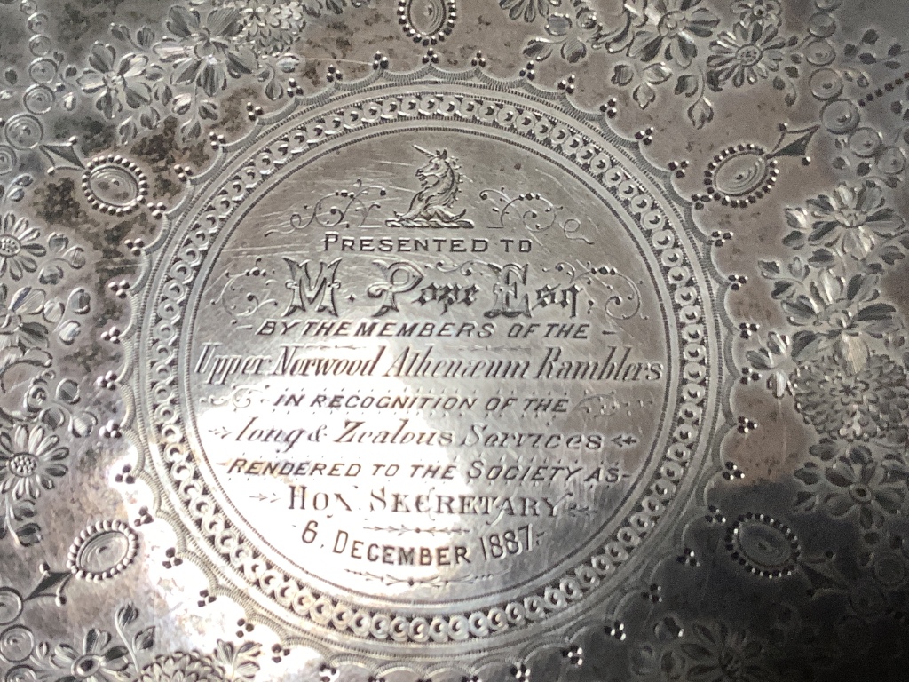 A Victorian engraved silver presentation salver by John Edward Bingham, Sheffield, 1885, width 35.6 cm, 32 oz, in oak box.